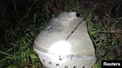 The debris, which the locals claim to be that of a missile, is pictured at the site of an explosion in Przewodow, a village in eastern Poland near the border with Ukraine, Nov. 16, 2022.