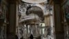 Church personnel inspect damage inside the Transfiguration Cathedral in Odesa, Ukraine, July 23, 2023, following Russian missile attacks.