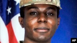 FILE - This portrait of American soldier Travis King is displayed at the home of his grandfather Carl Gates, July 19, 2023, in Kenosha, Wisconsin.