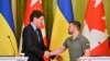 Ukrainian President Volodymyr Zelenskyy and Canadian Prime Minister Justin Trudeau shake hands during a press conference following their talks in Kyiv, June 10, 2023. 