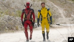 Ryan Reynolds as Deadpool/Wade Wilson, left, and Hugh Jackman as Wolverine/Logan are shown in a scene from "Deadpool & Wolverine." (20th Century Studios/Marvel Studios via AP)