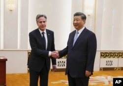 U.S. Secretary of State Antony Blinken shakes hands with Chinese President Xi Jinping in the Great Hall of the People in Beijing, China, Monday, June 19, 2023.