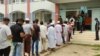 বরিশাল নগরীর একটি ভোটকেন্দ্রে ভোট দিতে লাইনে দাঁড়িয়েছেন ভোটাররা; ১২ জুন ২০২৩।
