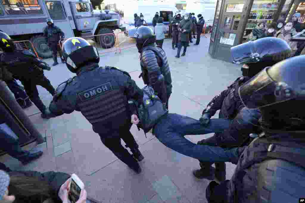 Police detain a demonstrator during a protest against Russia&#39;s attack on Ukraine in St. Petersburg, Russia.