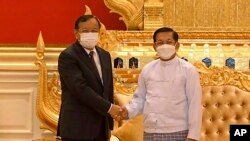 Myanmar's armed forces chief Senior General Min Aung Hlaing (R) shaking hands with Cambodia's Foreign Minister Prak Sokhonn, the Association of Southeast Asian Nations (ASEAN) special envoy to Myanmar, in Naypyidaw.
