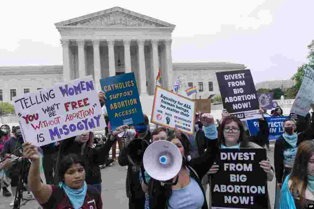 Demonstrators protest outside of the U.S. Supreme Court in Washington.&nbsp;A draft opinion suggests the Supreme Court could be poised to overturn the landmark 1973 Roe v. Wade case that legalized abortion nationwide, according to a Politico report released Monday.