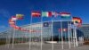FILE - Flags flutter in the wind outside NATO headquarters in Brussels, Feb. 7, 2022. 