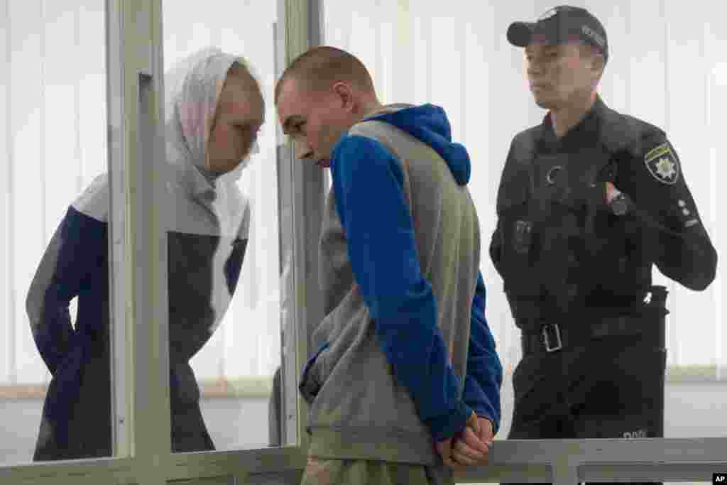 Russian Sgt. Vadim Shishimarin listens to his translator during a court hearing in Kyiv, Ukraine.&nbsp;The 21-year old soldier facing the first war crimes trial since the start of the war in Ukraine, plead guilty on May 18 to killing an unarmed civilian.