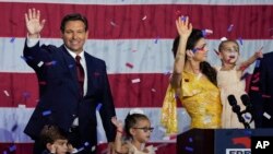 Incumbent Florida Republican Gov. Ron DeSantis, his wife Casey and their children on stage after speaking to supporters at an election night party after winning his race for reelection in Tampa, Nov. 8, 2022.