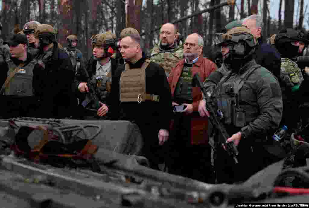 Lithuanian President Gitanas Nauseda, Polish President Andrzej Duda, Latvian President Egils Levits, Estonian President Alar Karis and Ukraine&#39;s Prime Minister Denys Shmyhal visit the village of Dmytrivka in Kyiv region, Ukraine, as Russia&#39;s attack on Ukraine continues, April 13, 2022.