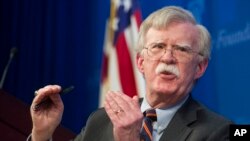 FILE - National Security Adviser John Bolton unveils the Trump Administration's Africa Strategy at the Heritage Foundation in Washington, Dec. 13, 2018. 