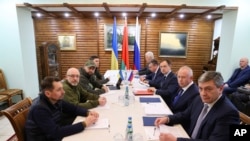 Delegations from Russia and Ukraine hold talks in talks in the Belavezhskaya Pushcha National Park, close to the Polish-Belarusian border, northward from Brest, in Belarus, March 7, 2022.