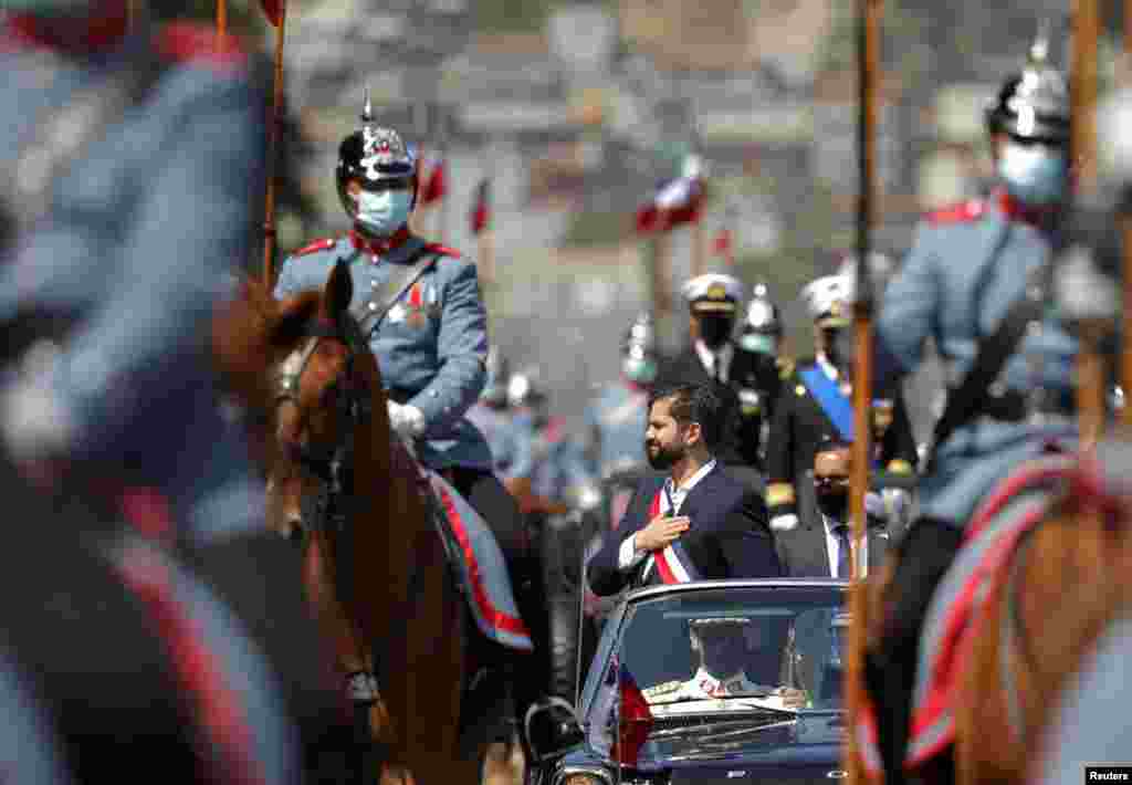 Chile&#39;s President Gabriel Boric gestures, after being sworn in at the Congress, in Valparaiso, Chile.