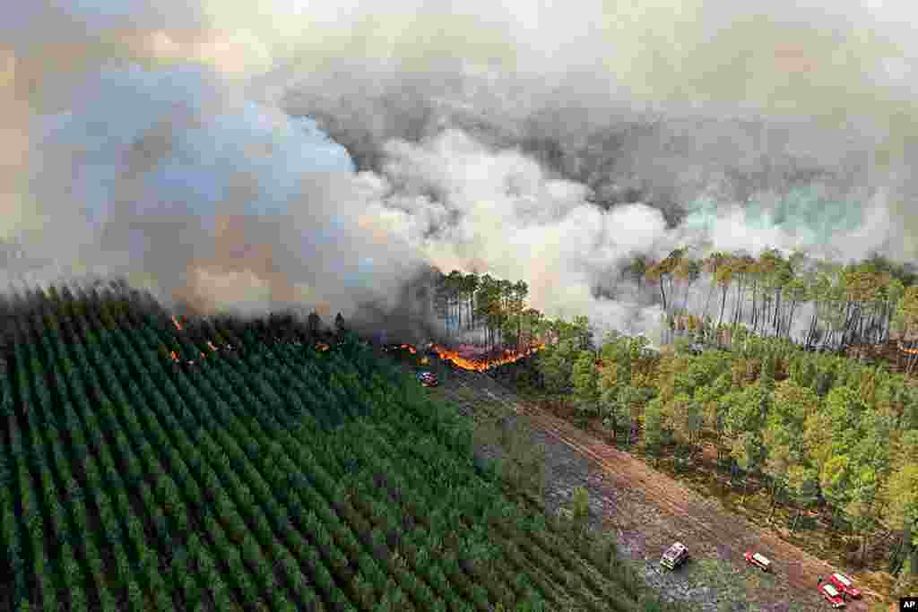 This photo provided by the fire brigade of the Gironde region (SDIS33) shows a wildfire burning near Landiras, France.