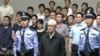 中国中央电视台2015年6月11日的电视画面显示前中共政治局常委周永康在天津听取一家法庭对他的判决
