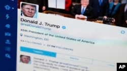 FILE photo shows President Donald Trump's tweeter feed on a computer screen in Washington. 