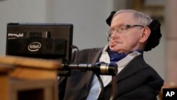 FILE - Cosmologist Stephen Hawking, pictured in London, March 6, 2017, is among the academics, technology experts and rights groups who have warned about the threats posed by artificial intelligence, amid concerns that it might one day control weapons systems.