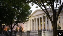 FILE - In this Wednesday, Oct. 16, 2013, file photo, the U.S. Treasury Building stands in Washington. On Friday, April 15, 2016, the Treasury Department reports on foreign holdings of U.S. debt for February. 