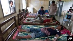 This Aug. 26, 2009 photo shows patients suffering from malaria being treated at the hospital in Pailin, Cambodia. 