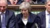 英国首相特蕾莎·梅在议会否决脱欧协议后坐在议会里。（2019年1月15日）