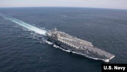 FILE - The Nimitz-class aircraft carrier USS Abraham Lincoln transits the Atlantic Ocean during a strait transit exercise, Jan. 30, 2019.