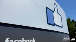 This file photo shows a sign at Facebook headquarters in Menlo Park, Calif. Facebook says hackers accessed data from 29 million accounts as part of the security breach disclosed two weeks ago.