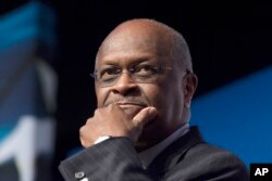 FILE - Herman Cain speaks during Faith and Freedom Coalition's Road to Majority event in Washington, June 20, 2014.