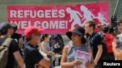  People gather for an anti-racism rally in downtown Toronto, Aug. 11, 2018. Canada announced Wednesday plans to increase deportations of immigrants in the country illegally.