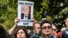 FILE - President of Human Right Association (IHD) Eren Keskin (R) speaks to journalists during a demonstration in front of the Saudi Arabian consulate in Istanbul, in support of missing journalist and Riyadh critic Jamal Khashoggi, Oct. 9, 2018.