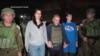 TOPSHOT - This handout picture courtesy of the government of Israel taken on October 20, 2023 shows Natalie Shoshana Raanan (2nd L) and Judith Tai Raanan (2nd R) after being held hostage and later released by Hamas at an undiclosed location.