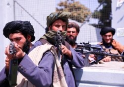 Taliban forces stand guard in front of Hamid Karzai International Airport in Kabul, Afghanistan, September 2, 2021.