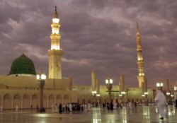 FILE -- In this July 5, 2013 photo, worshipers visit the Prophet's Mosque in Medina, Saudi Arabia.