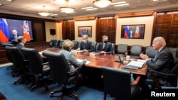 FILE - U.S. President Joe Biden holds virtual talks with Russia's President Vladimir Putin amid Western fears that Moscow plans to attack Ukraine, Situation Room at the White House in Washington, Dec. 7, 2021..
