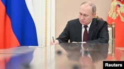 Russian President Putin chairs a meeting in Moscow