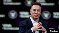 FILE PHOTO: Tesla CEO and Twitter owner Elon Musk attends the VivaTech conference in Paris