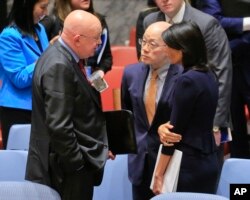 United Nations Ambassadors Vasily Nebenzya of Russia, left, Liu Jieyi of China, center, and Nikki Haley of the U.S., right, confer after the United Nations nonproliferation meeting on North Korea, Sept. 4, 2017 at U.N. headquarters.