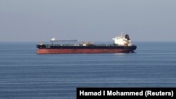 Oil tankers pass through the Strait of Hormuz