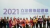 “爱国者治港”候选人2021年12月20日庆祝自己在星期天的立法会选举中当选（路透社）