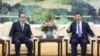 2016年6月1日中国领导人习近平（右）在北京会见朝鲜劳动党中央政治局委员李洙墉