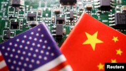 FILE PHOTO: Illustration picture of Chinese and U.S. flags with semiconductor chips
