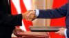  U.S. President Barack Obama and Russian President Dmitry Medvedev shake hands as they exchange the signed new Strategic Arms Reduction Treaty (START II) at Prague Castle in Prague, April 8, 2010.