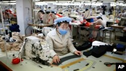 North Korean workers sew items at a factory of a South Korean-owned company at the jointly-run Kaesong Industrial Complex, in Kaesong, North Korea.