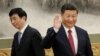 New Politburo Standing Committee member Wang Huning (L) walks past China's President Xi Jinping as they and other new Politburo Standing Committee members meet with the press at the Great Hall of the People in Beijing, China October 25, 2017. 