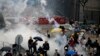 2019年6月12日，香港防暴警察在立法会外向抗议者发射催泪弹。