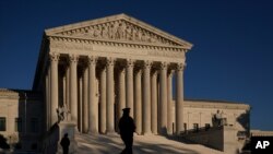 The Supreme Court is seen at sundown on the eve of Election Day, in Washington, Monday, Nov. 2, 2020. President Donald Trump and his reelection campaign are signaling they will pursue an aggressive legal strategy to try to prevent Pennsylvania from…